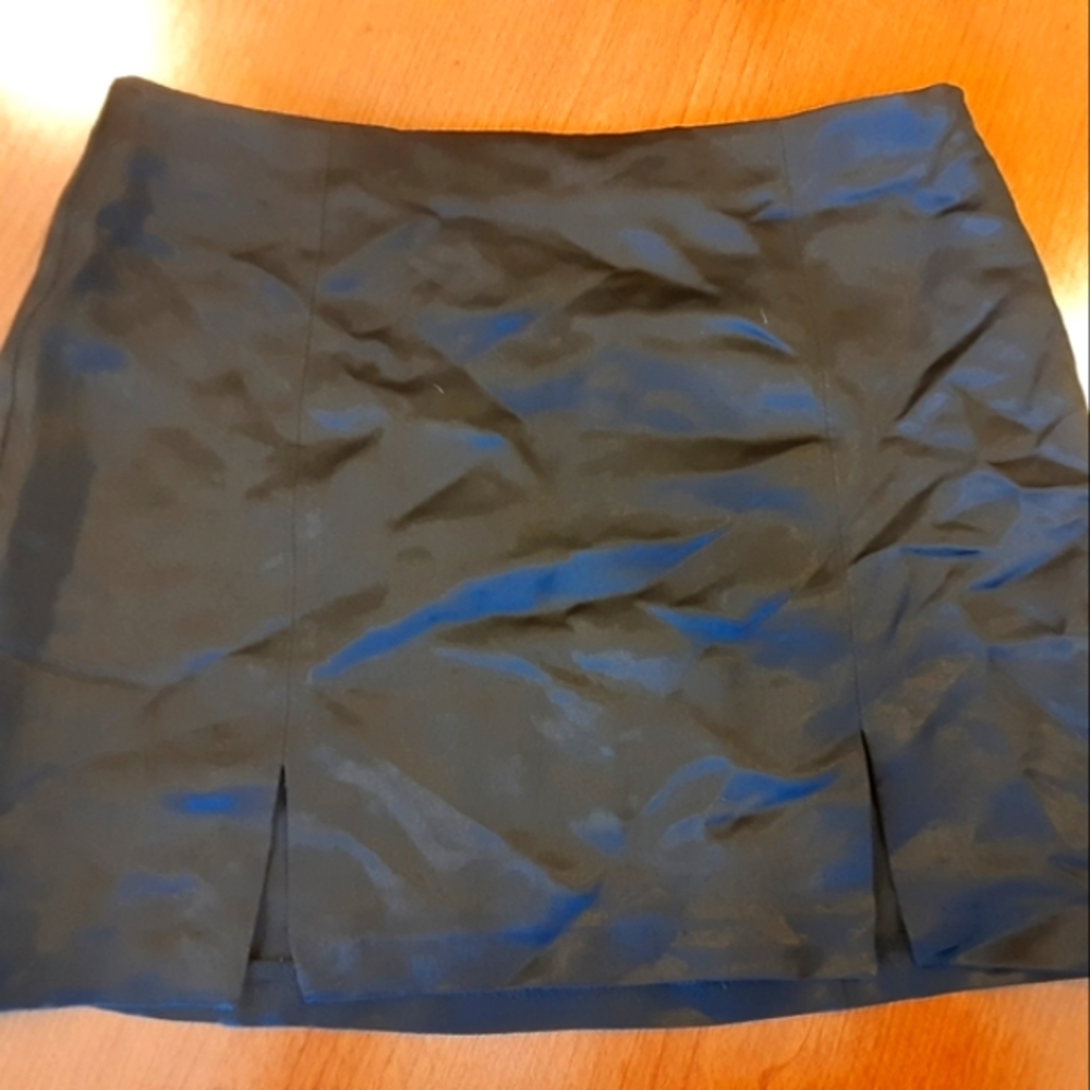 A black skirt with two small slits in front